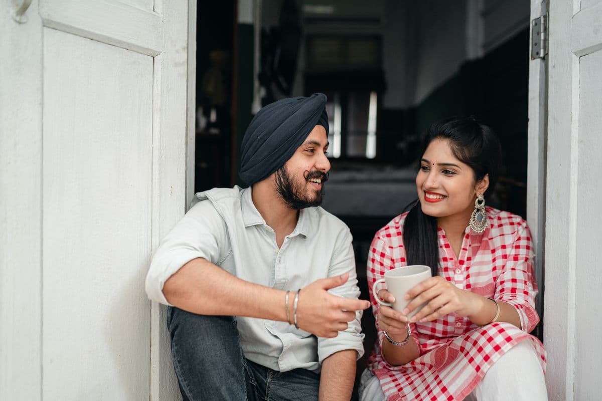 Two people talking warmly, one listening with care